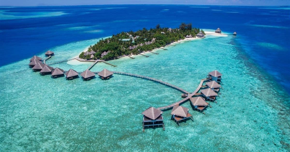 Aerial view of Maldives overwater villas in turquoise lagoon