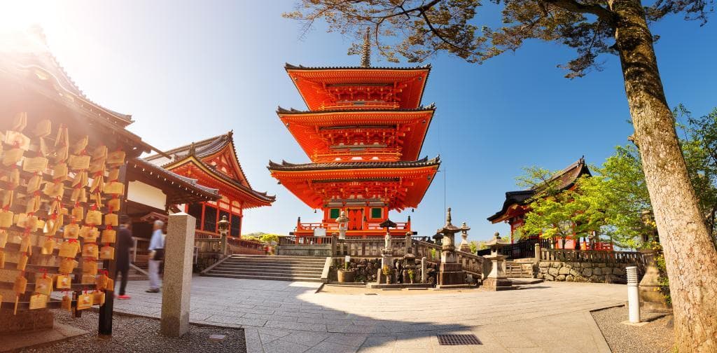 Traditional Japanese temple pagoda with cherry blossoms